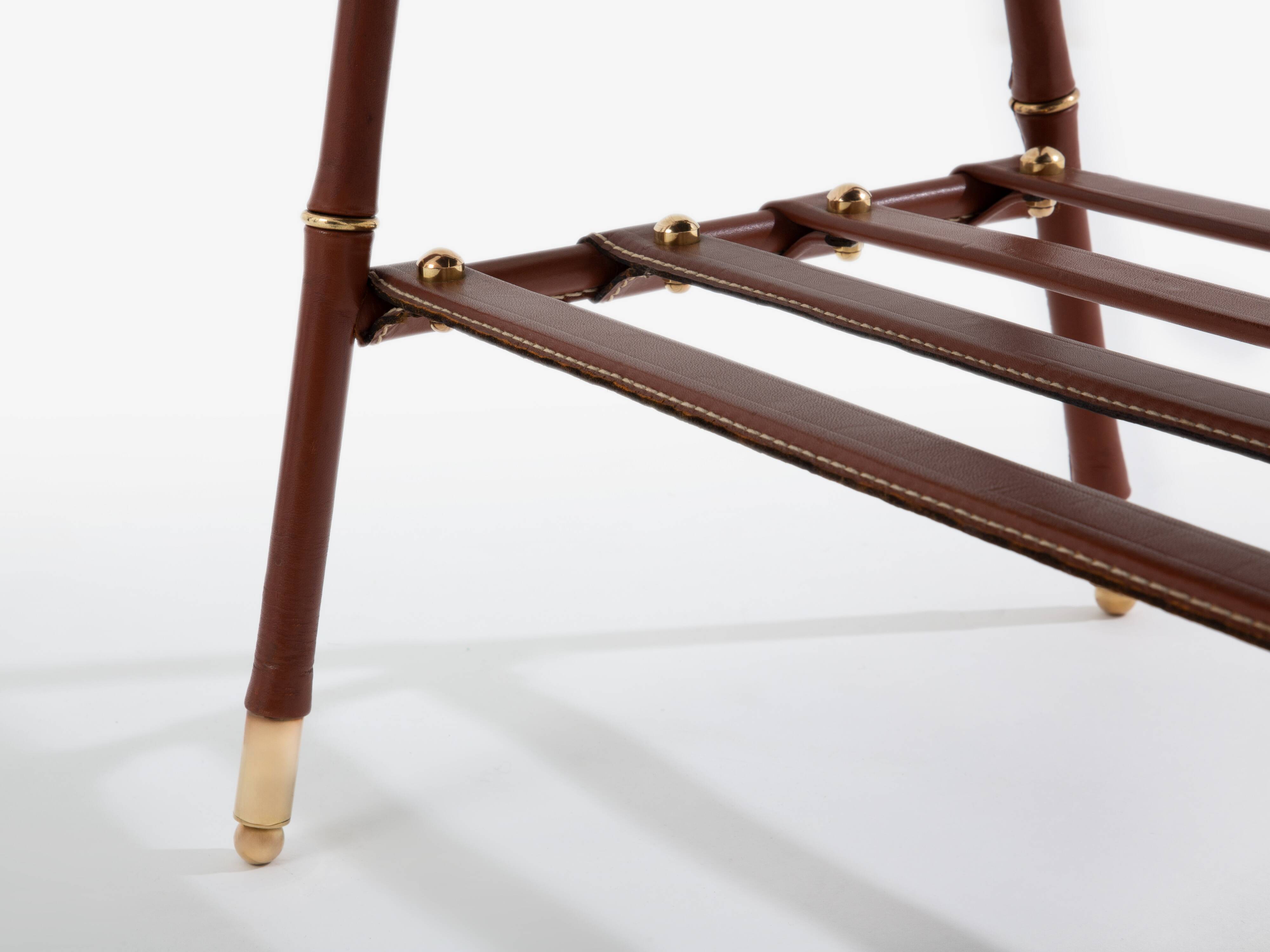 Jacques Adnet coffee table in red saddle-stitched leather and brass, 1950s