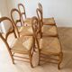 Set of 6 traditional wooden chairs with woven straw.