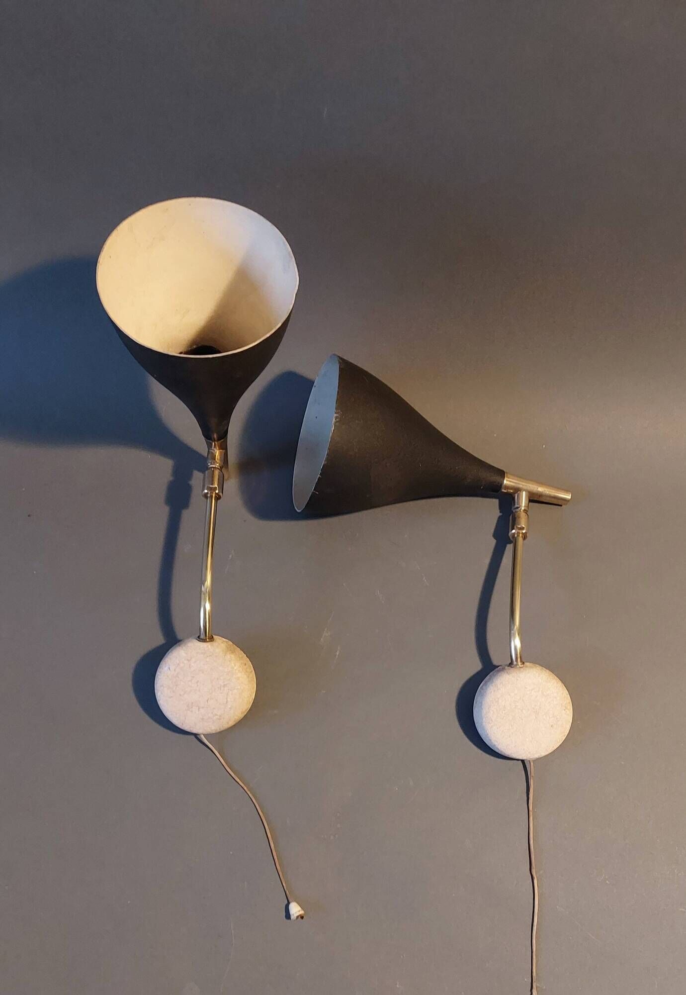 Pair of bedroom sconces in gilded brass and black aluminum 1960.