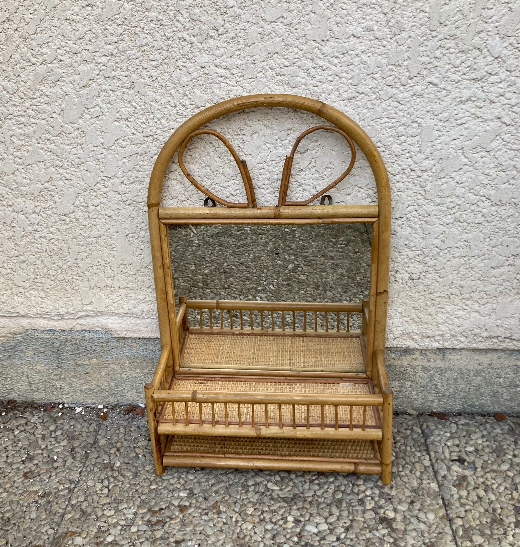 Vintage rattan wall shelf with mirror