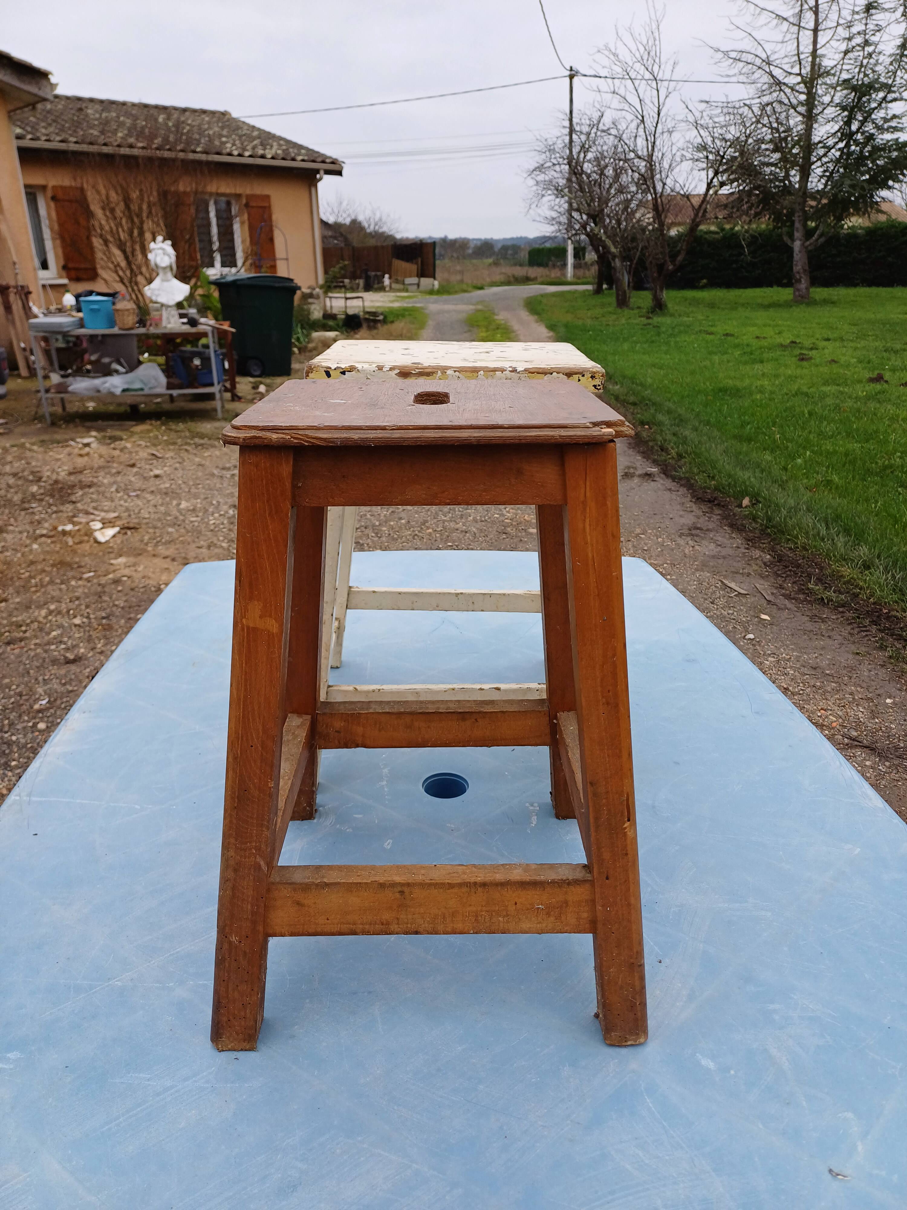 2 wooden workshop stools
