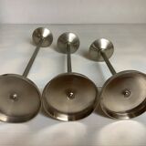 Trio of metal and wood candlesticks