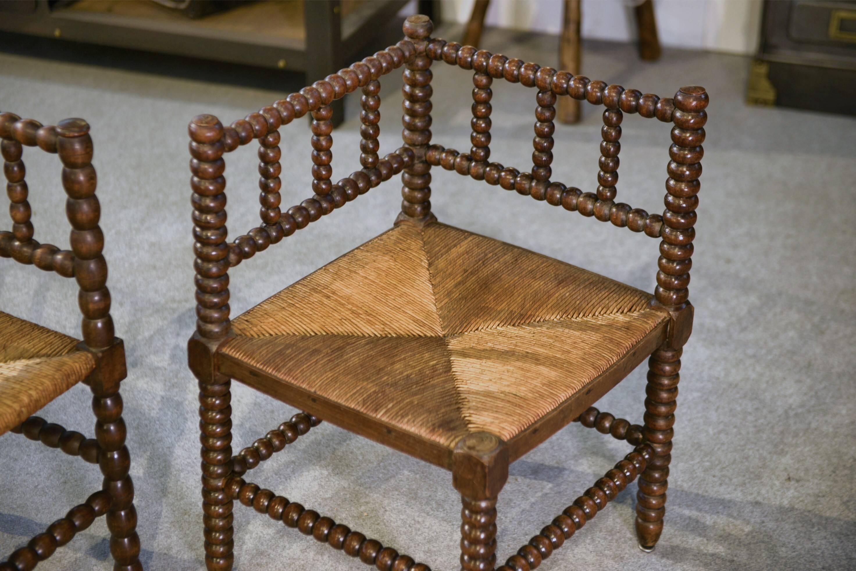 Pair of turned wooden corner chairs from the 1950s.