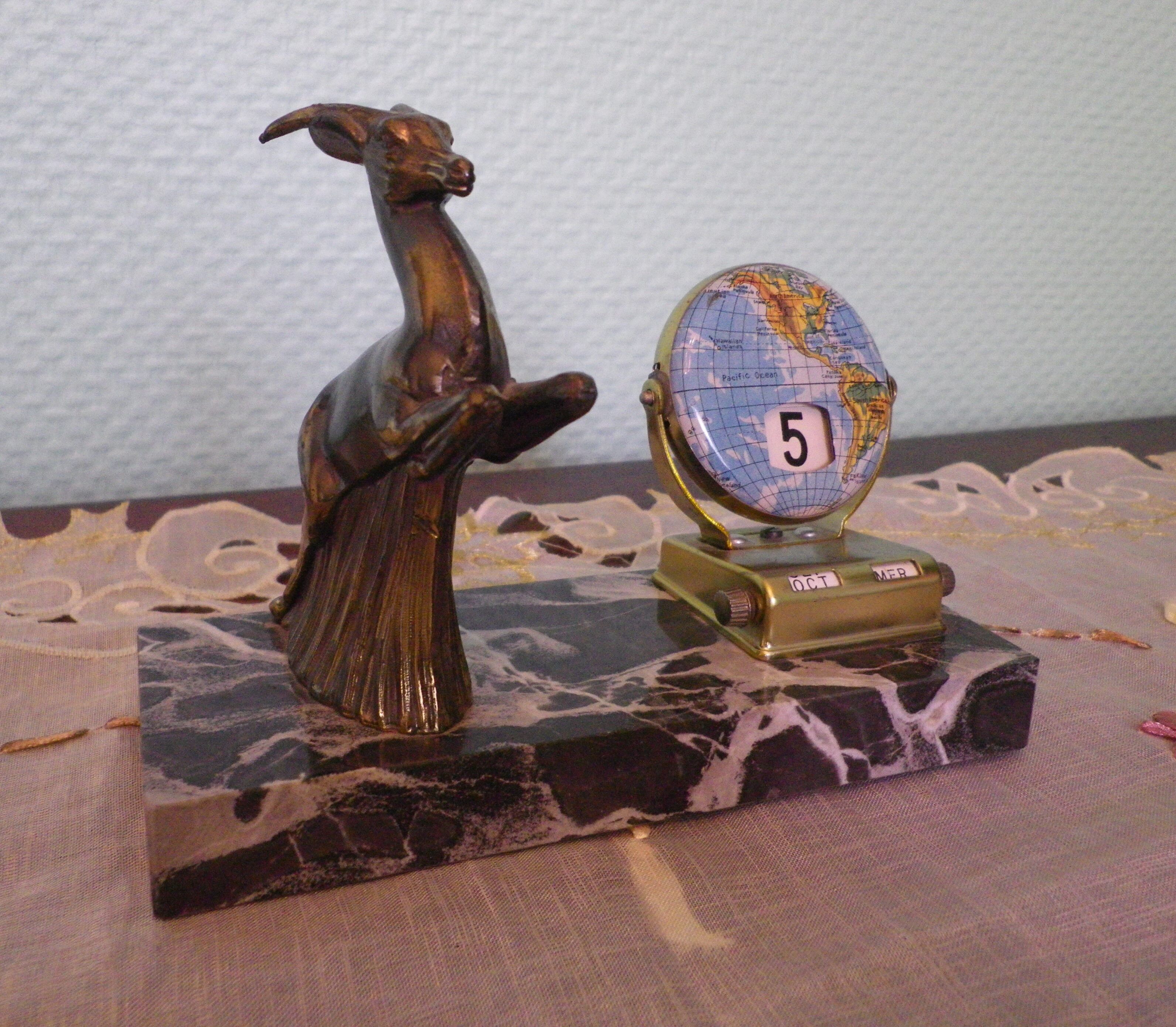 Perpetual calendar on marble base with marble patinated regulated decoration, 60s