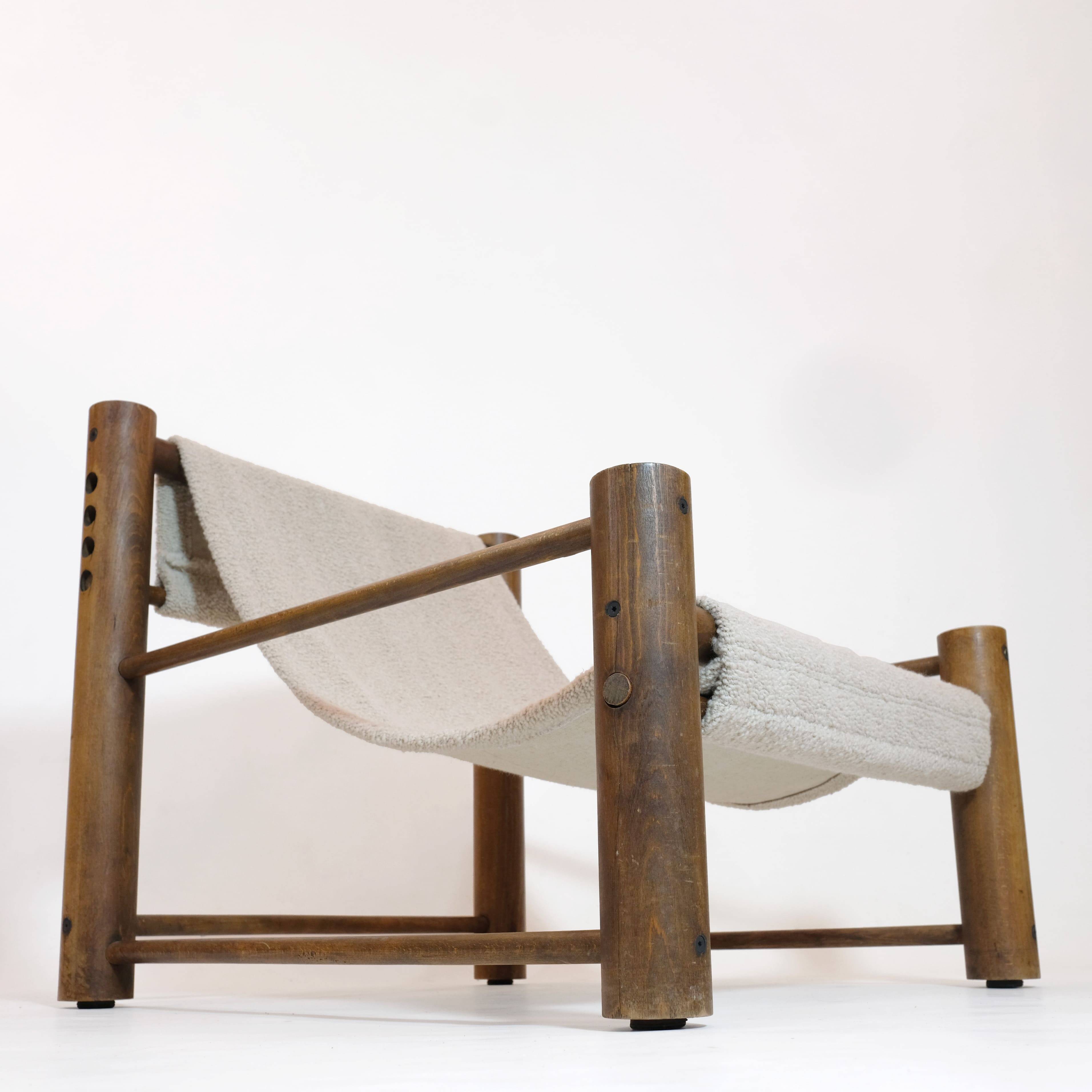 Solid wood armchair with adjustable backrest.