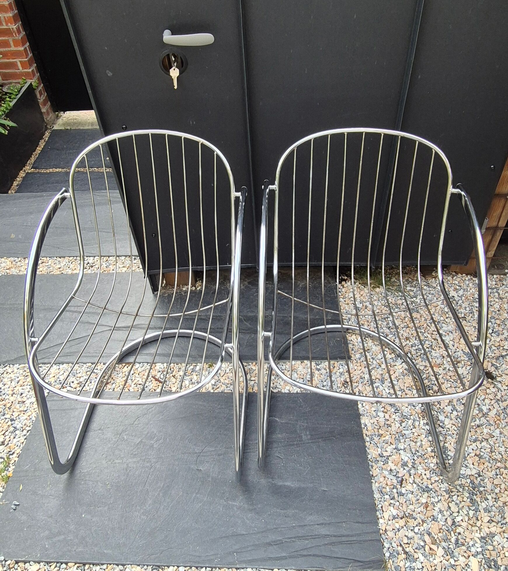 A pair of space age wire chairs