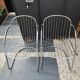 A pair of space age wire chairs