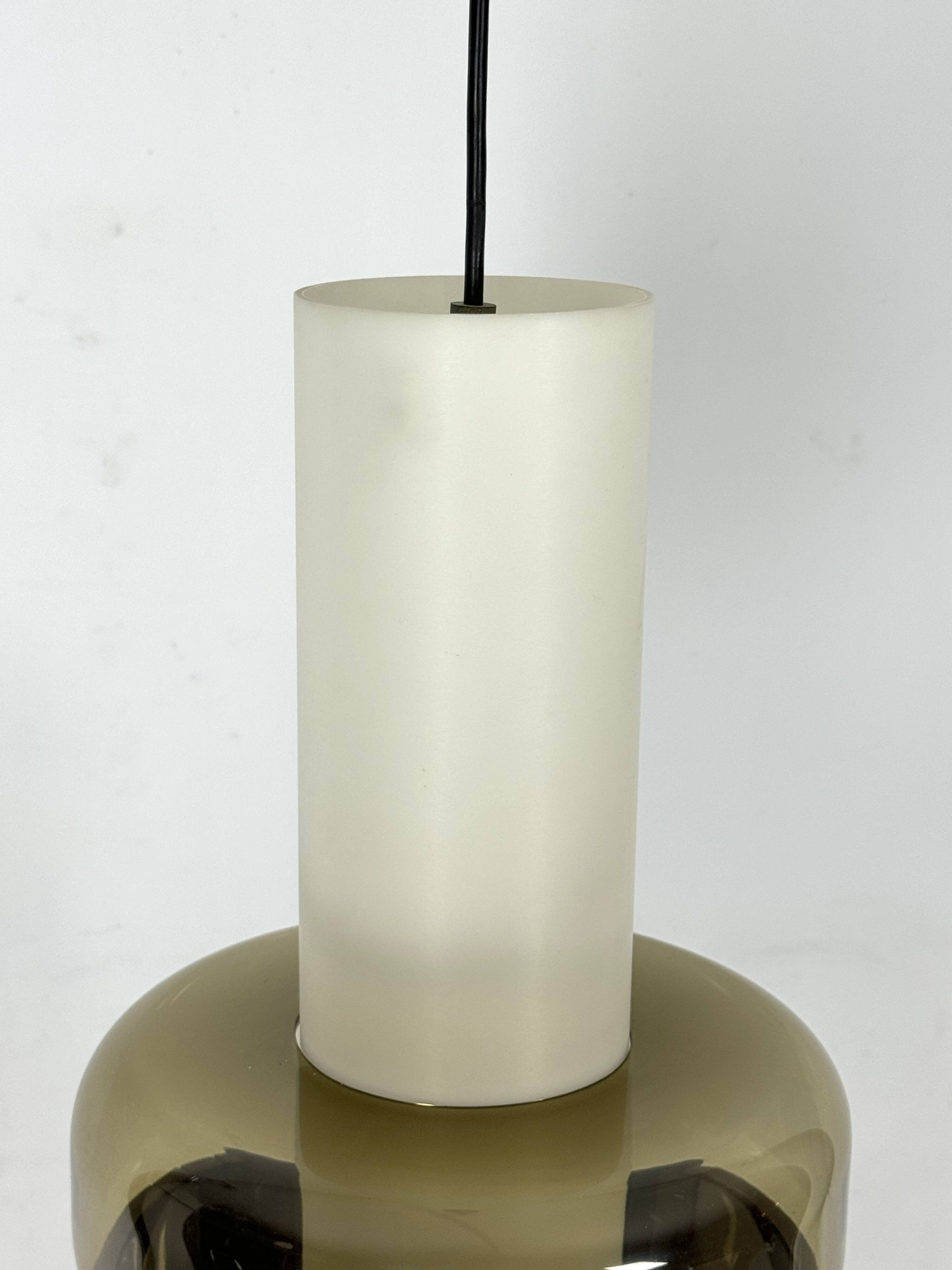 Mid-Century Harvey Guzzini pendant from 1960s. Labeled.