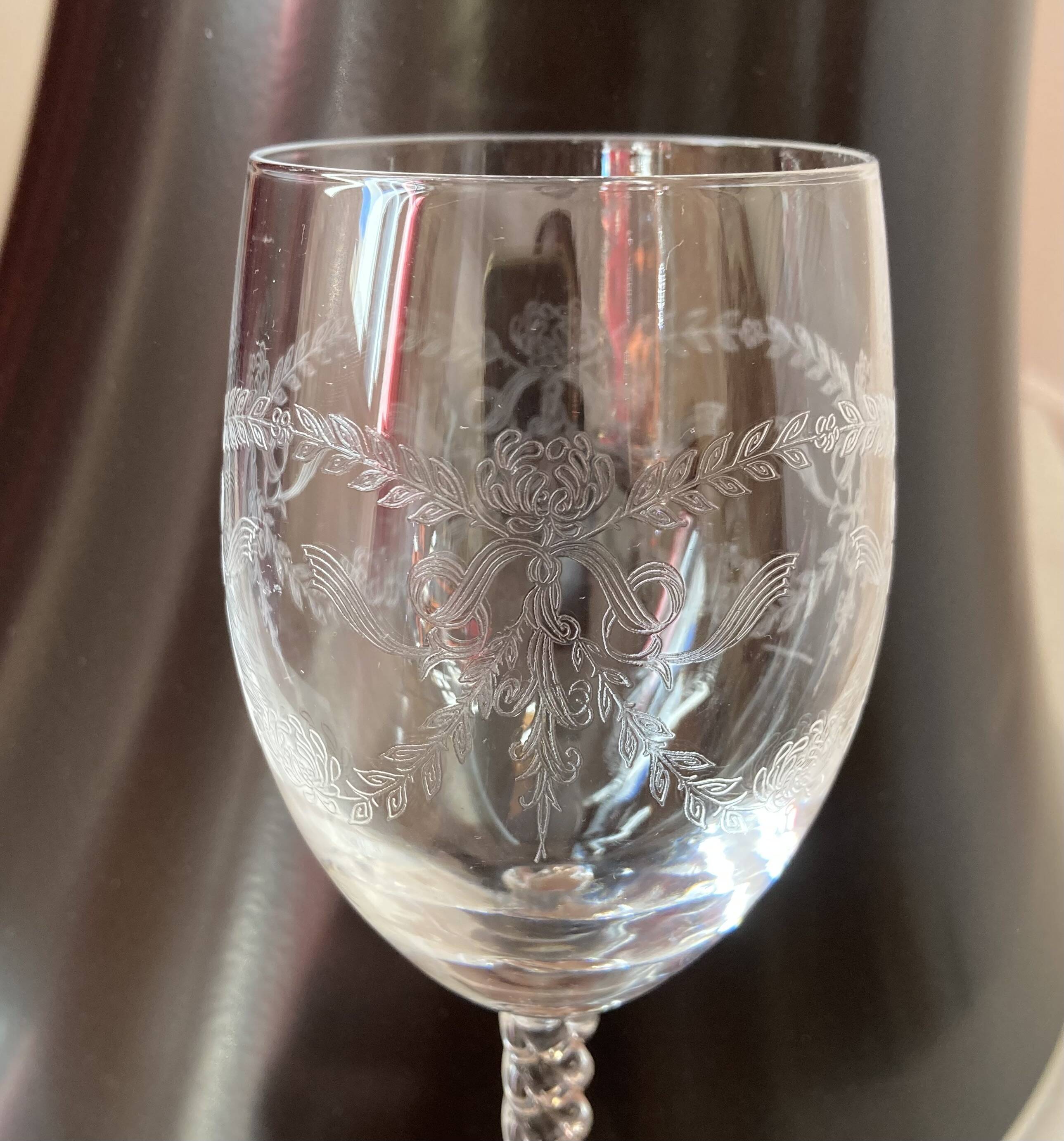 Set of 9 tall twisted and engraved crystal wine glasses