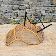 Fauteuil en rotin et piétement en métal noir 1960