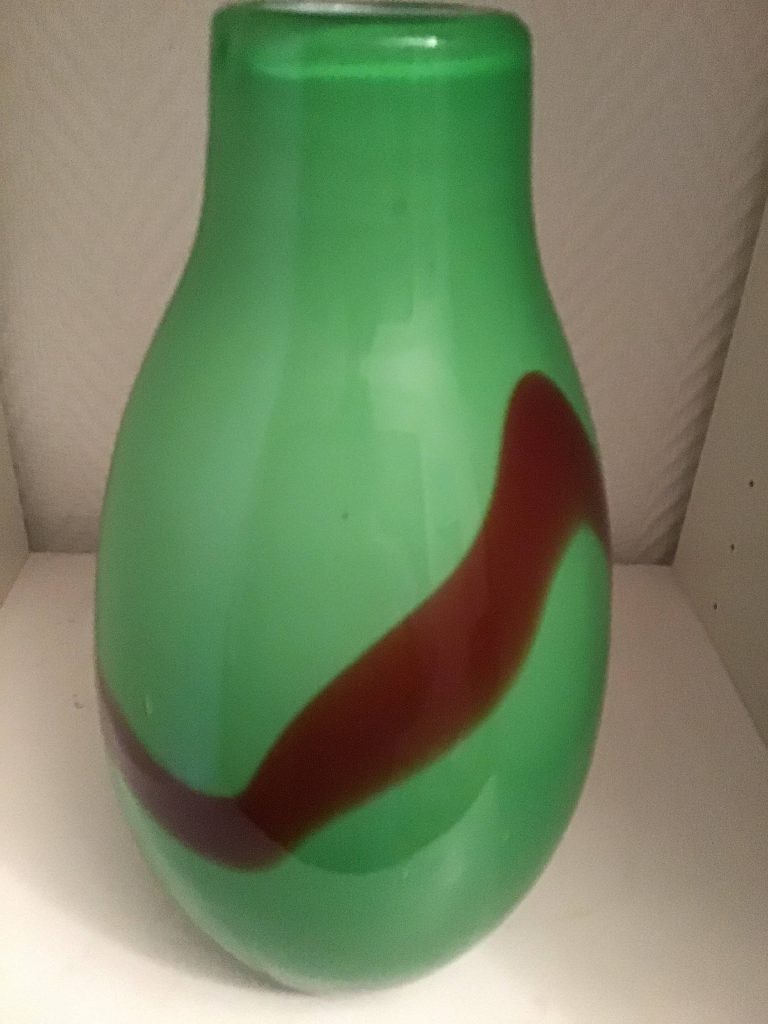 Very thick green glass vase with brown accents, very heavy, perfect condition.