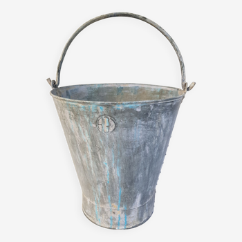 Old bucket with thick zinc handle
