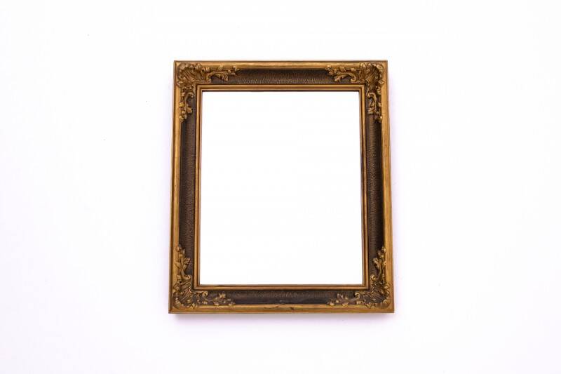 Mirror in a decorative gold frame, 63.5 x 54 cm