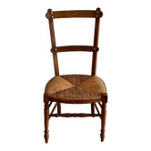 Chaise basse « nourrice » paillée vintage
