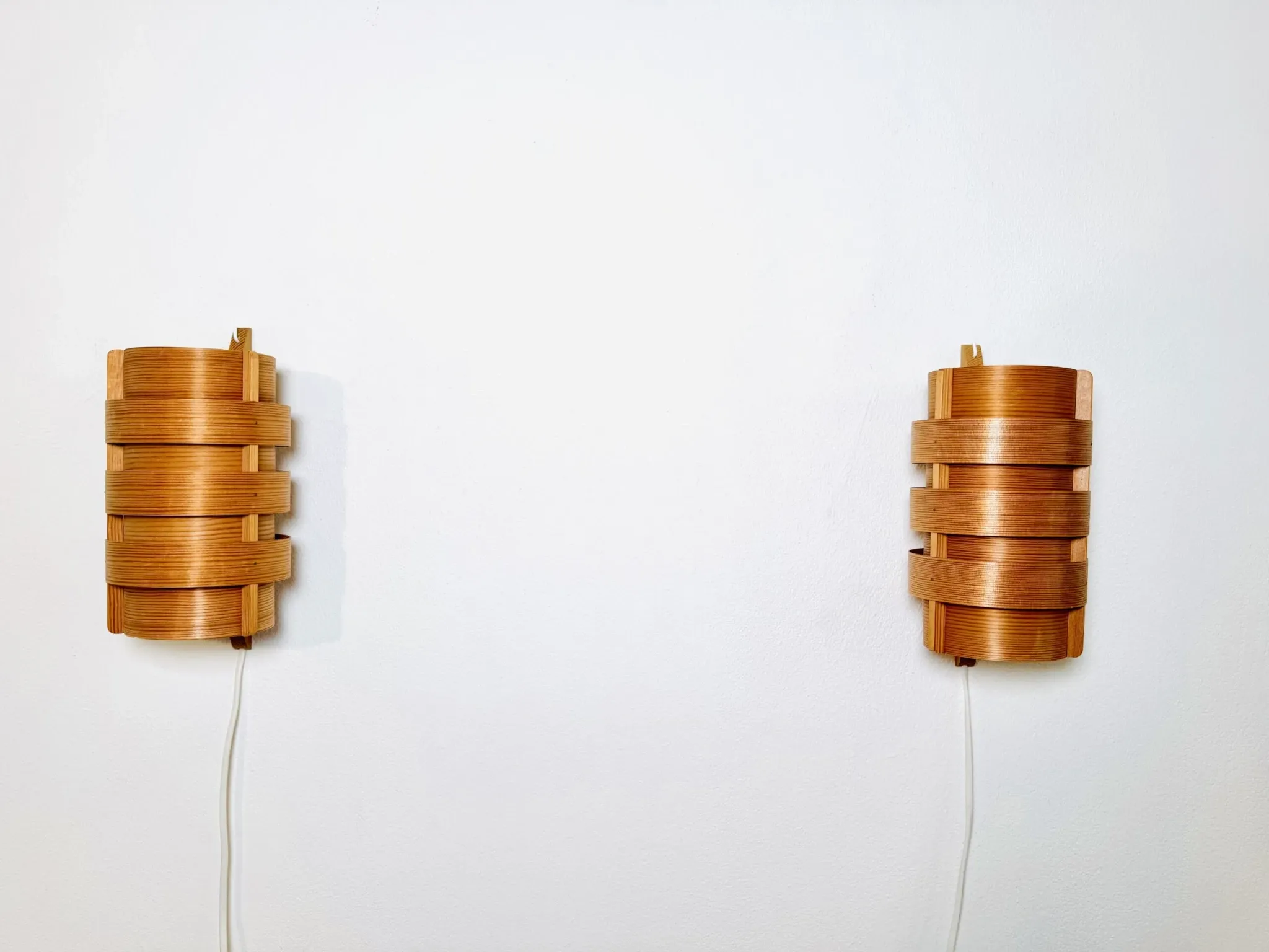 Wall sconces in pine veneer by Hans-Agne Jakobsson for Ab Ellysett, Sweden, 1960s.