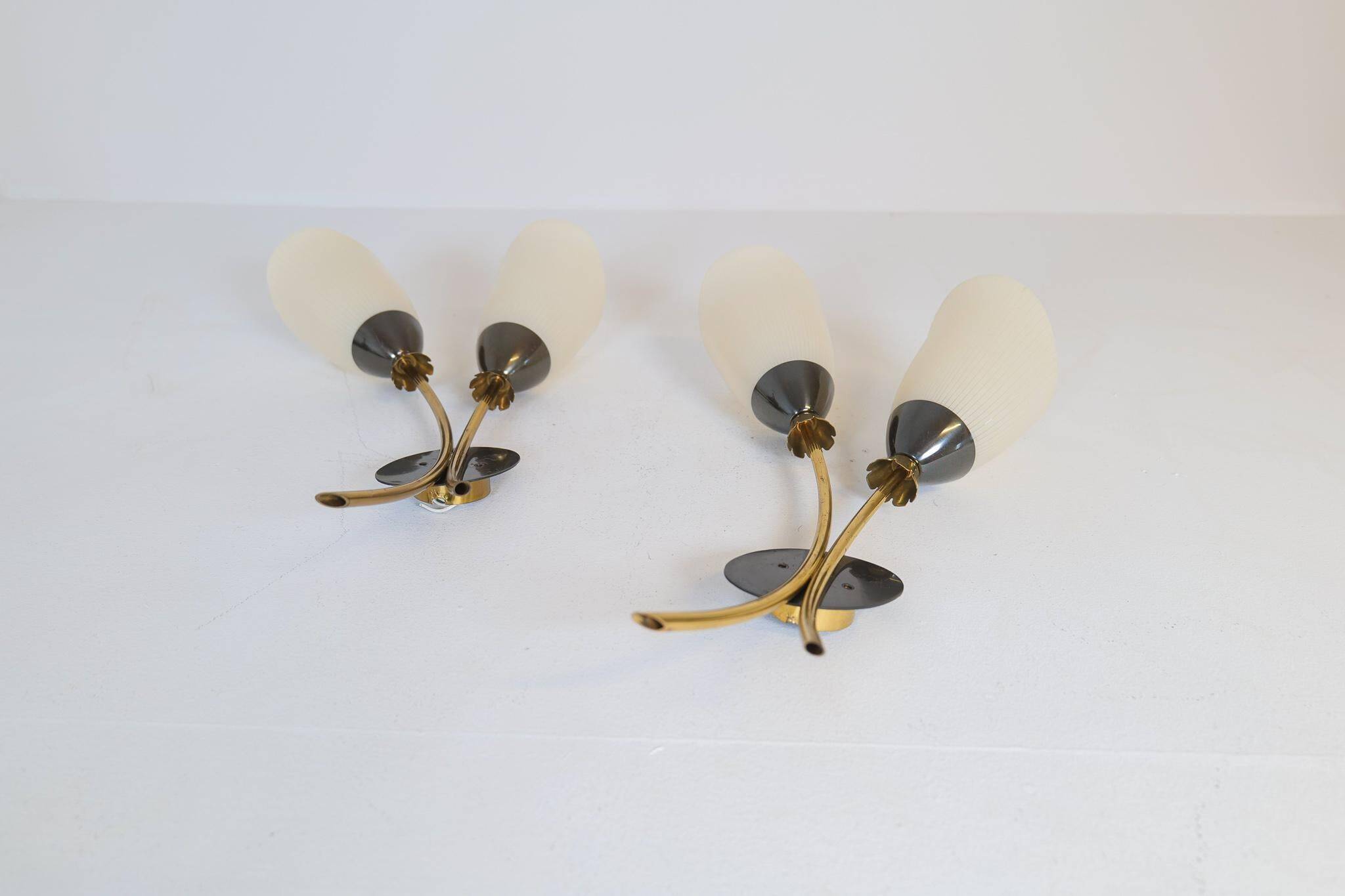 Mid-century pair of wall lamps in brass and opaline attributed to Asea Sweden, 1950s.