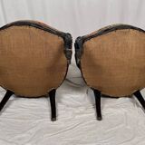 Pair of Napoleon III armchairs, in blackened wood, floral patterned fabric