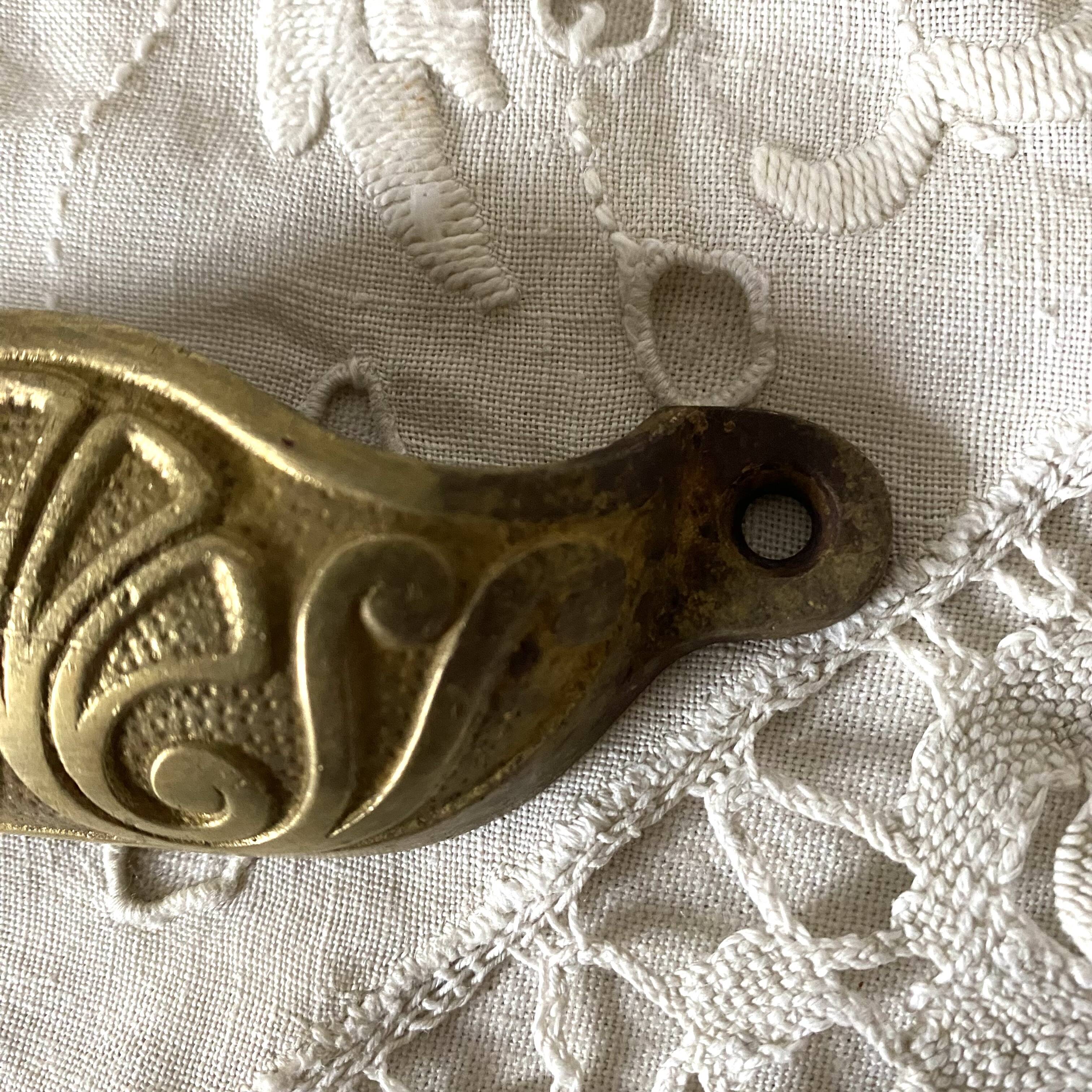 Old shell drawer handle in gilded brass