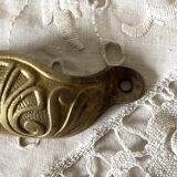 Old shell drawer handle in gilded brass