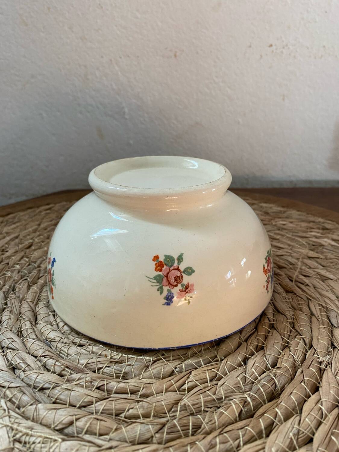 Flowery bowl with blue edging.