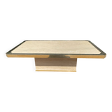 Vintage coffee table in travertine and brass.