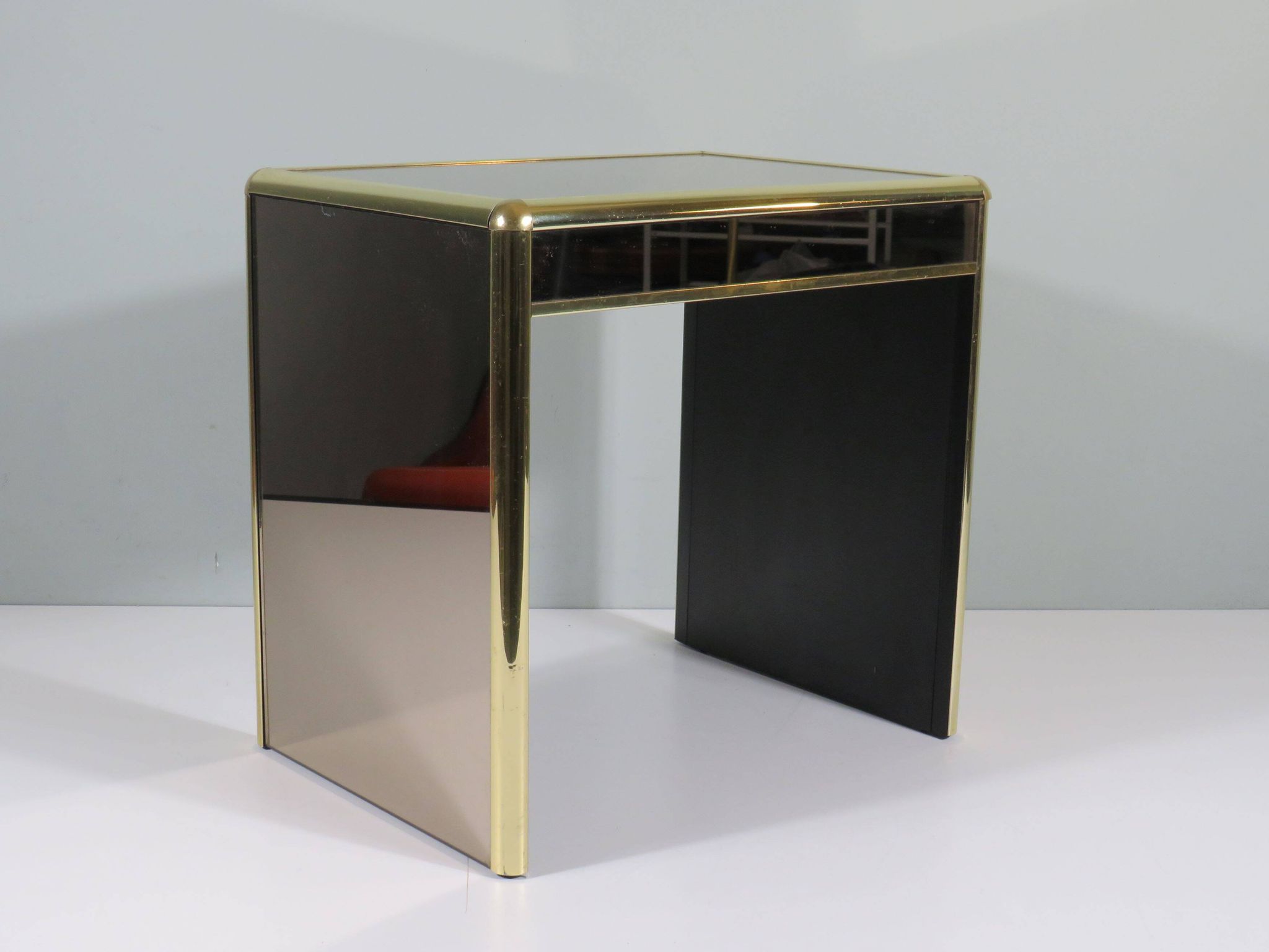 Occasional table or side table in Hollywood Regency style.