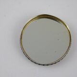 Small round box with silver pills