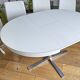 Extendable round table in white formica and 4 matching chairs by Roche Bobois.