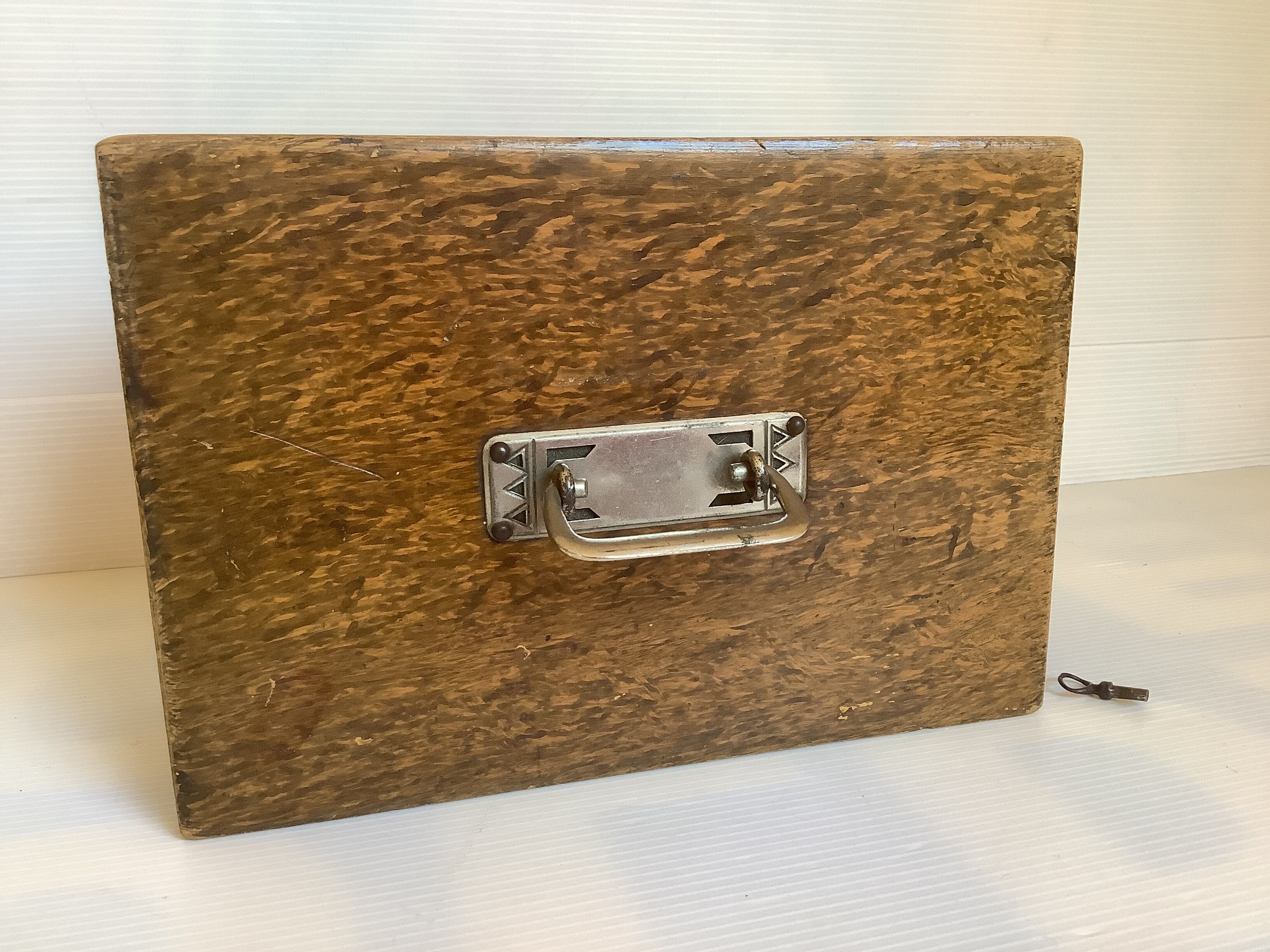 Old wooden box with handle and metal keys