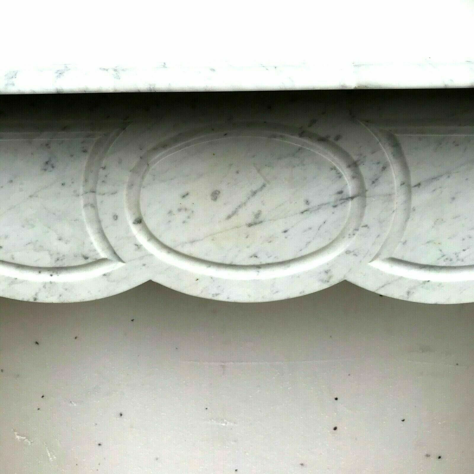 Veined white marble fireplace "model Pompadour a right jambage"