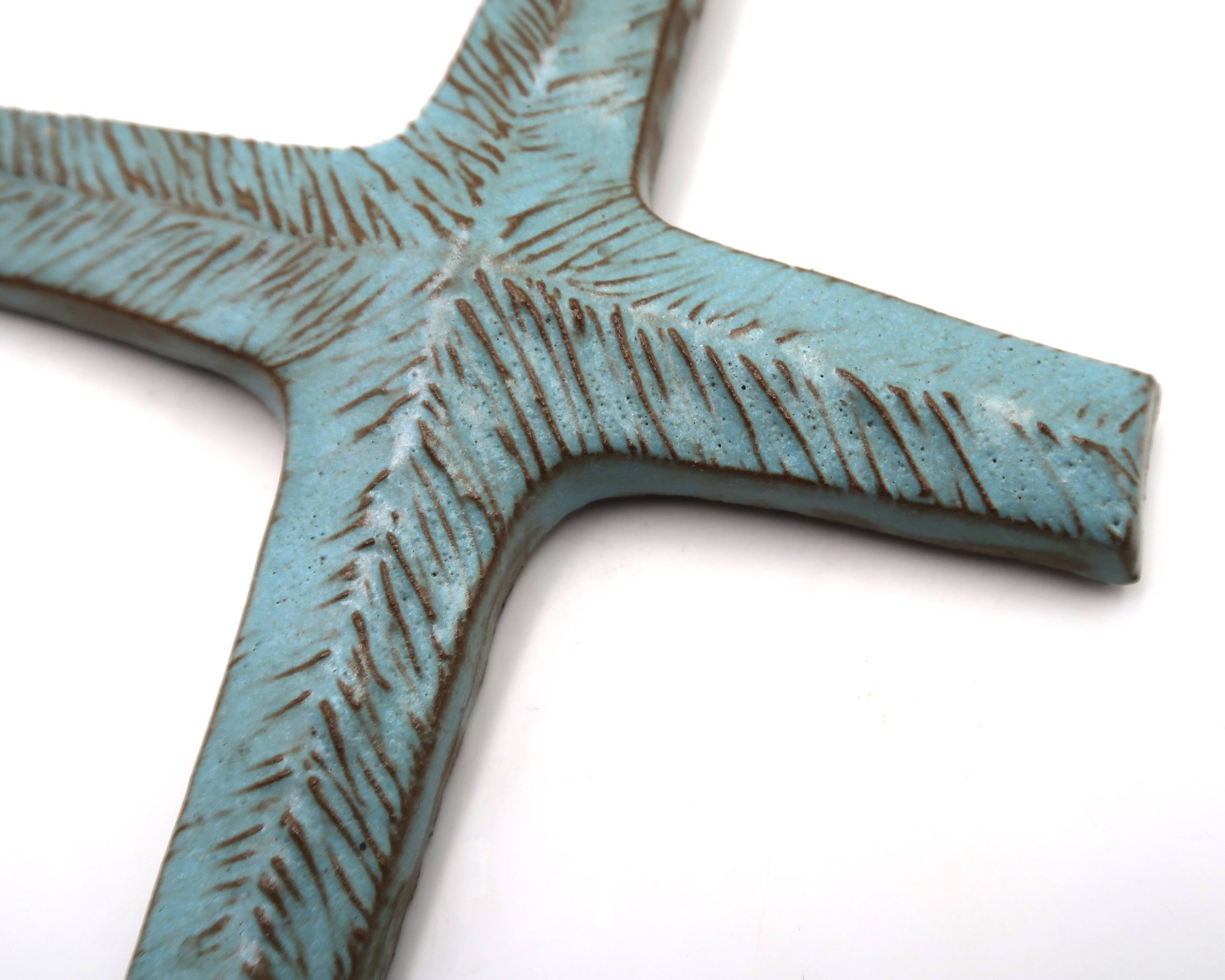 Pale blue ceramic wall cross signed Amphora, 1970s.