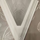 Pair of Art Deco wall sconces in plaster and pressed glass.