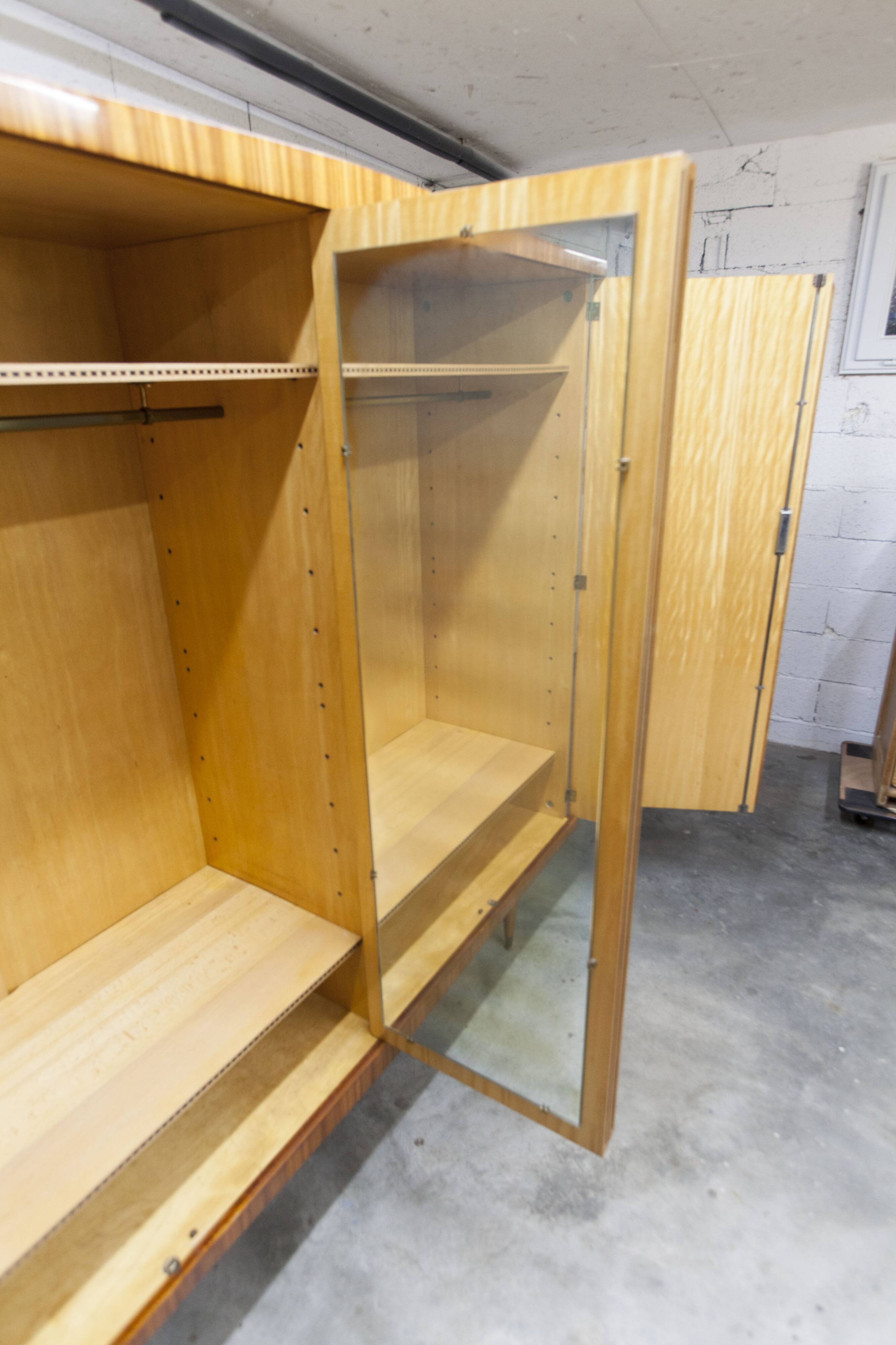 1960s Scandinavian wardrobe, blonde varnished wood, unusual, 4 doors, 3 drawers, 7 shelves.