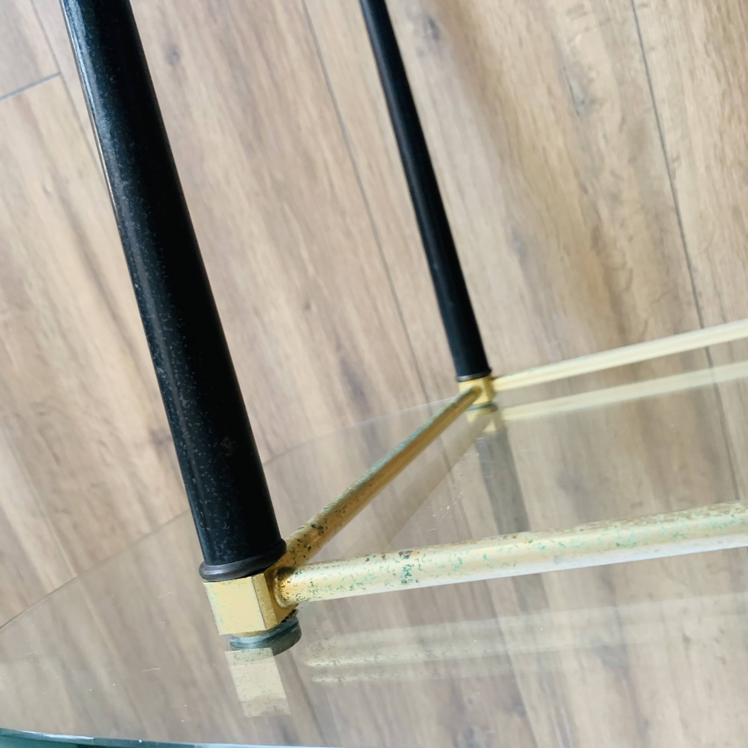 Coffee table from the 50s/60s, glass, brass, black metal.