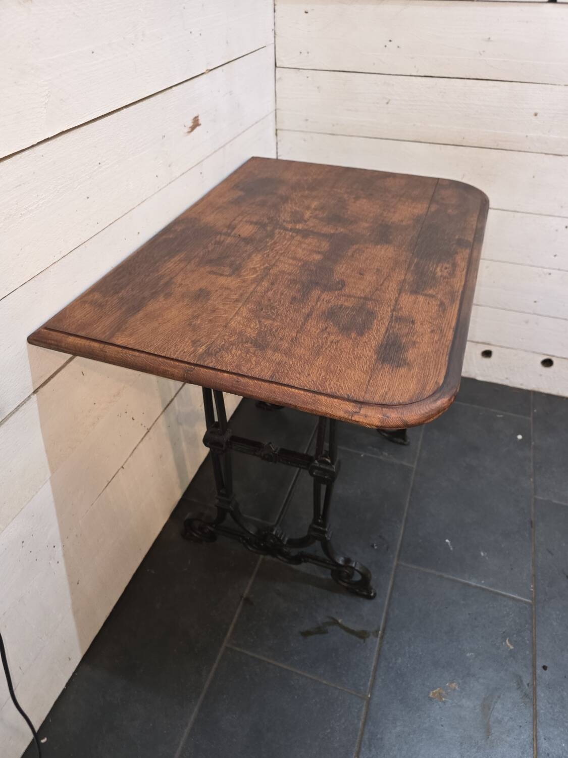 Bistro table with cast iron legs and oak top