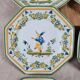 Set of 12 small antique plates by Alfred Renoleau, different designs.