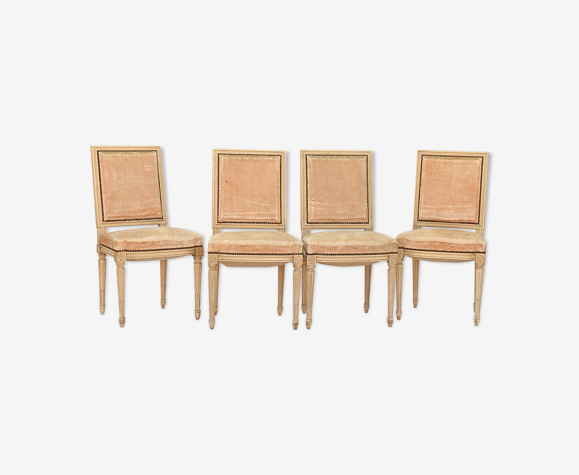 4 chaises en bois laqué blanc de style Louis XVI