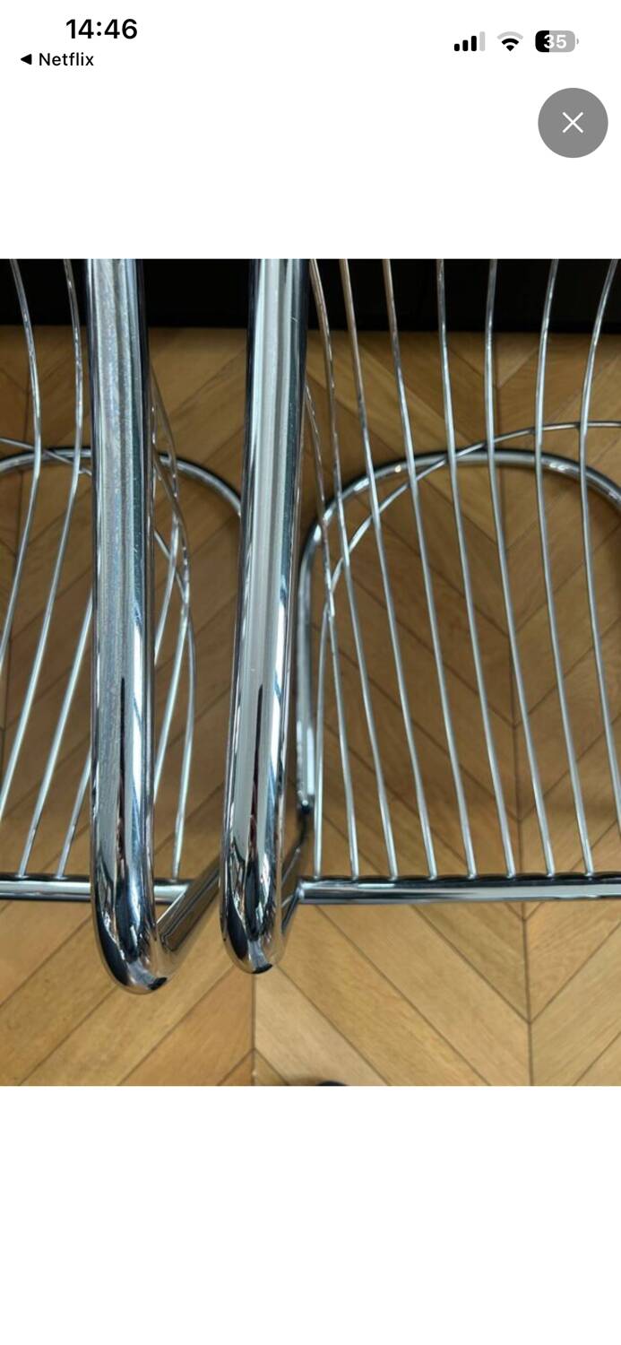 6 chrome metal chairs in the style of Gastonne Ronaldo.