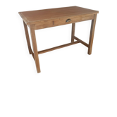 Wooden farmhouse table with one drawer.
