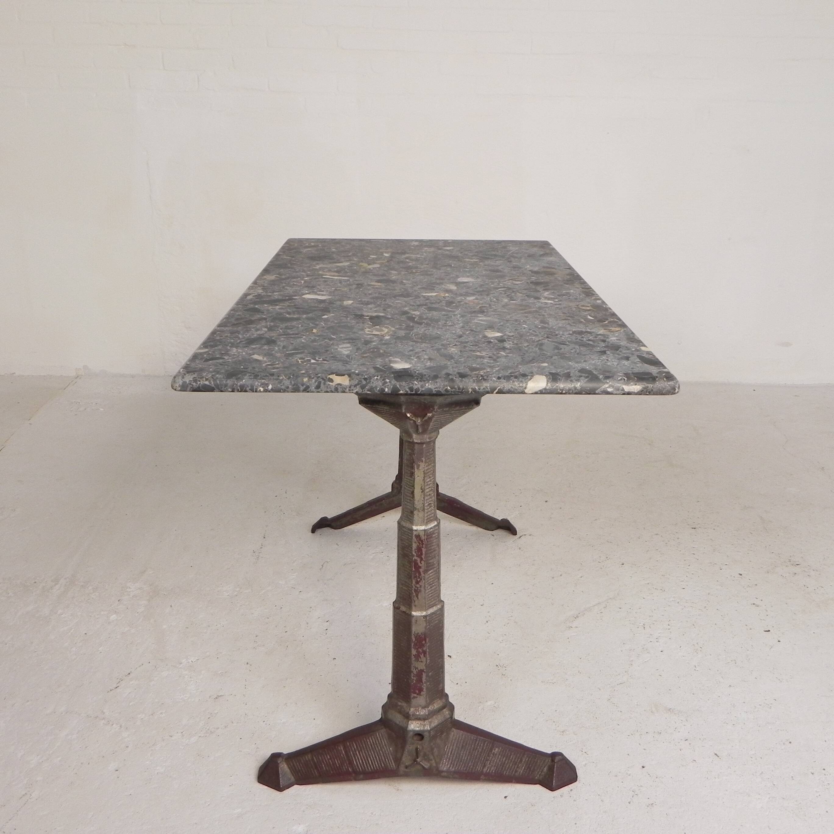 Bistro table with a marble top on a cast iron frame, 1930s.