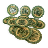 12 barbotine plates from Sarreguemines with a vine design.