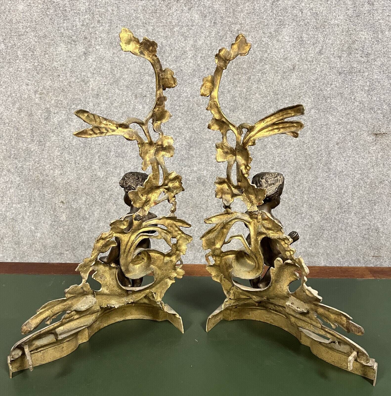 Pair of gilded bronze and patinated bronze andirons depicting putti circa 1850