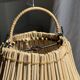 Suspension or rattan lampshade in the shape of a woven bulb.