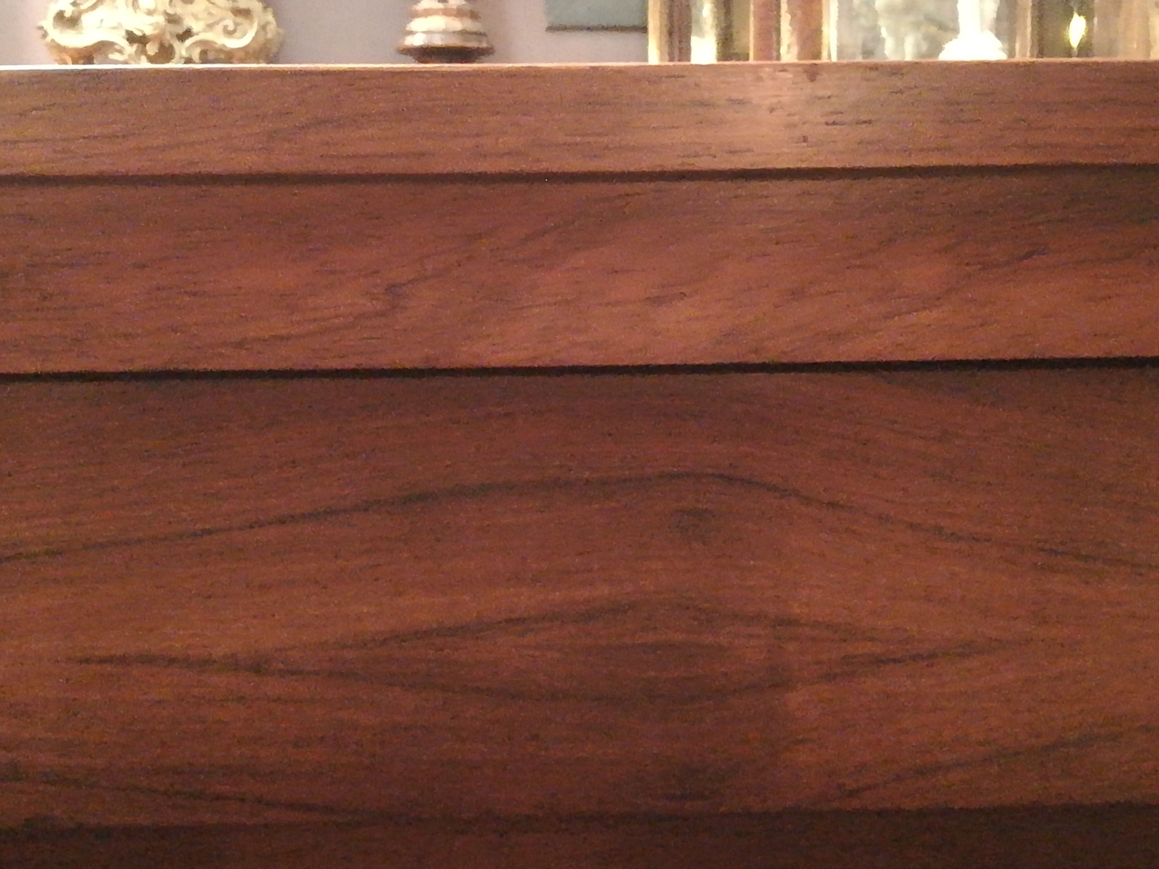 Rosewood and brushed metal chest of drawers