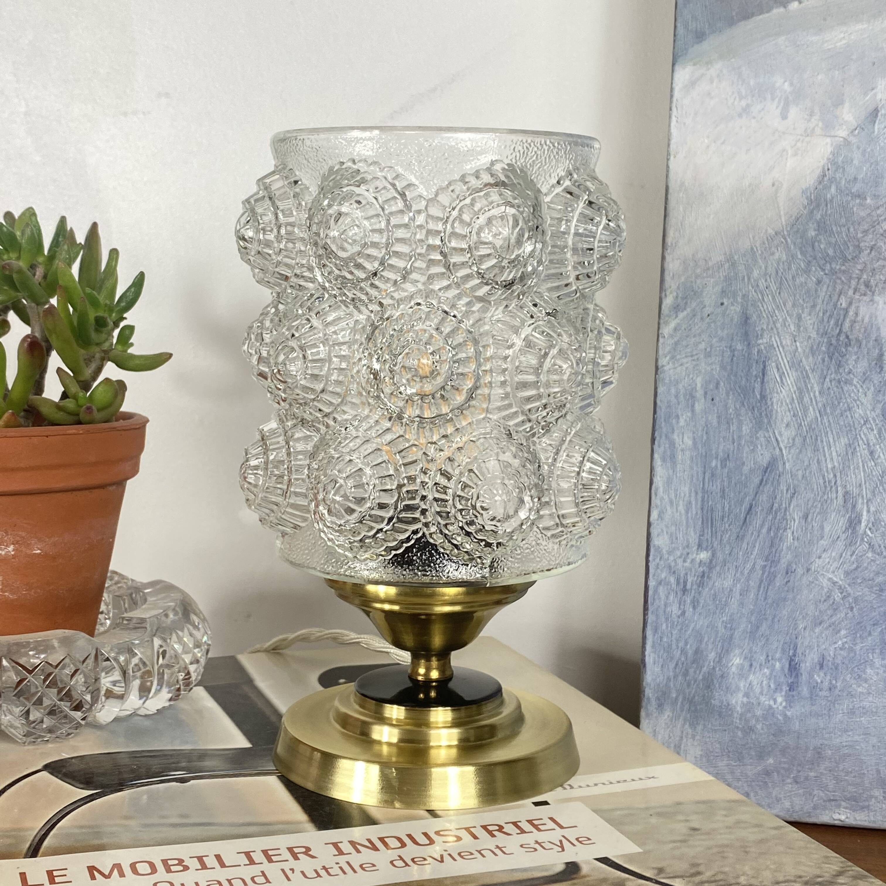 Antique globe table lamp in moulded transparent glass with a brass base.