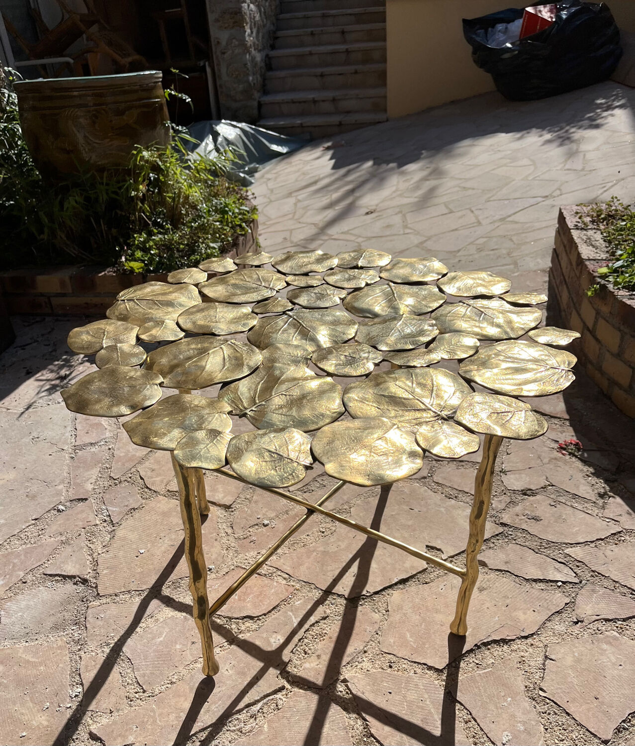 Carved brass coffee table with ginkgo decor