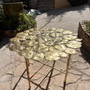 Carved brass coffee table with ginkgo decor