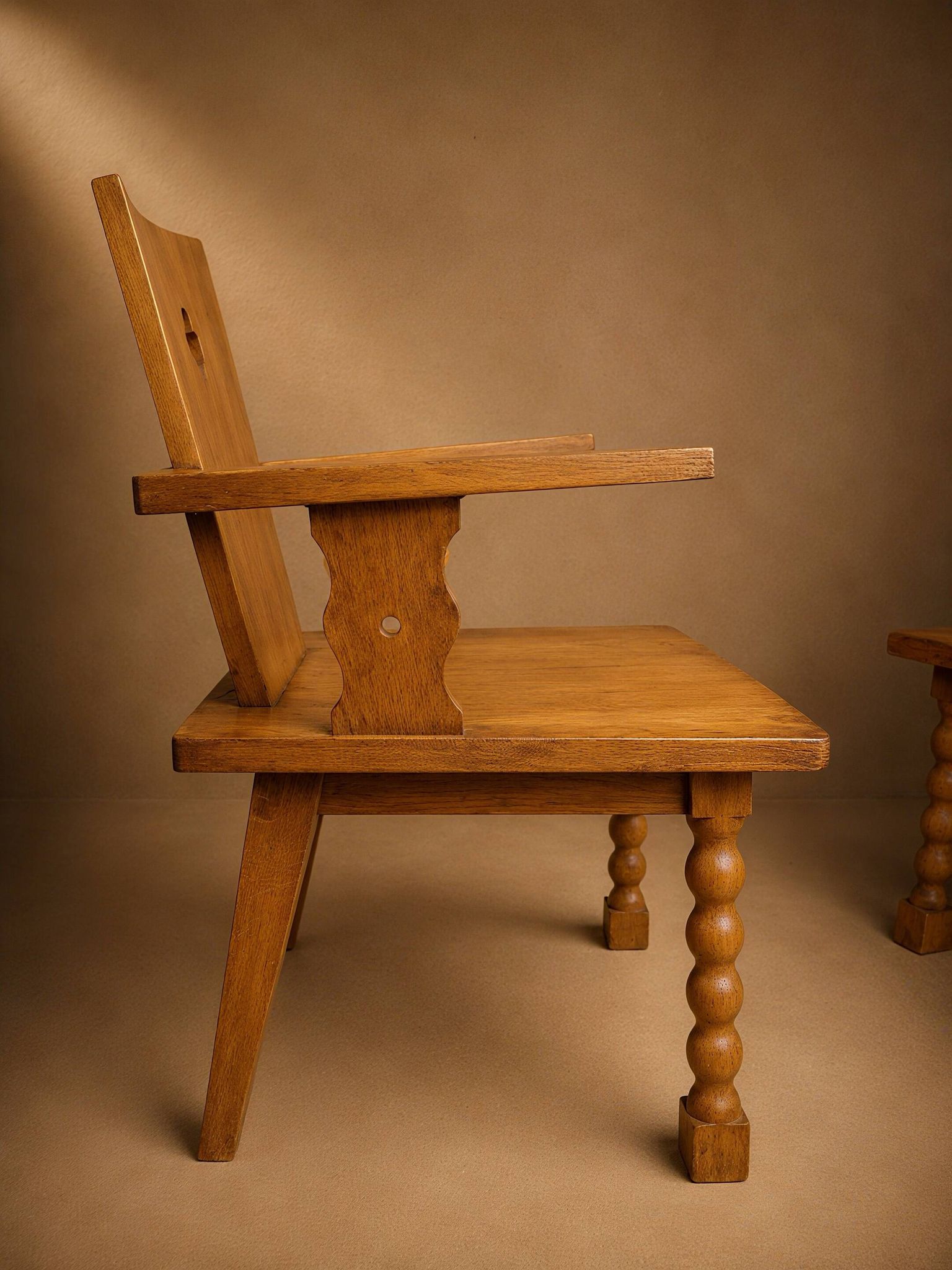 Pair of brutalist armchairs, oak, France, circa 1950.