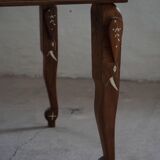 Vintage Indian teak coffee table inlaid with elephant motifs, mid-20th century.