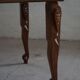 Vintage Indian teak coffee table inlaid with elephant motifs, mid-20th century.
